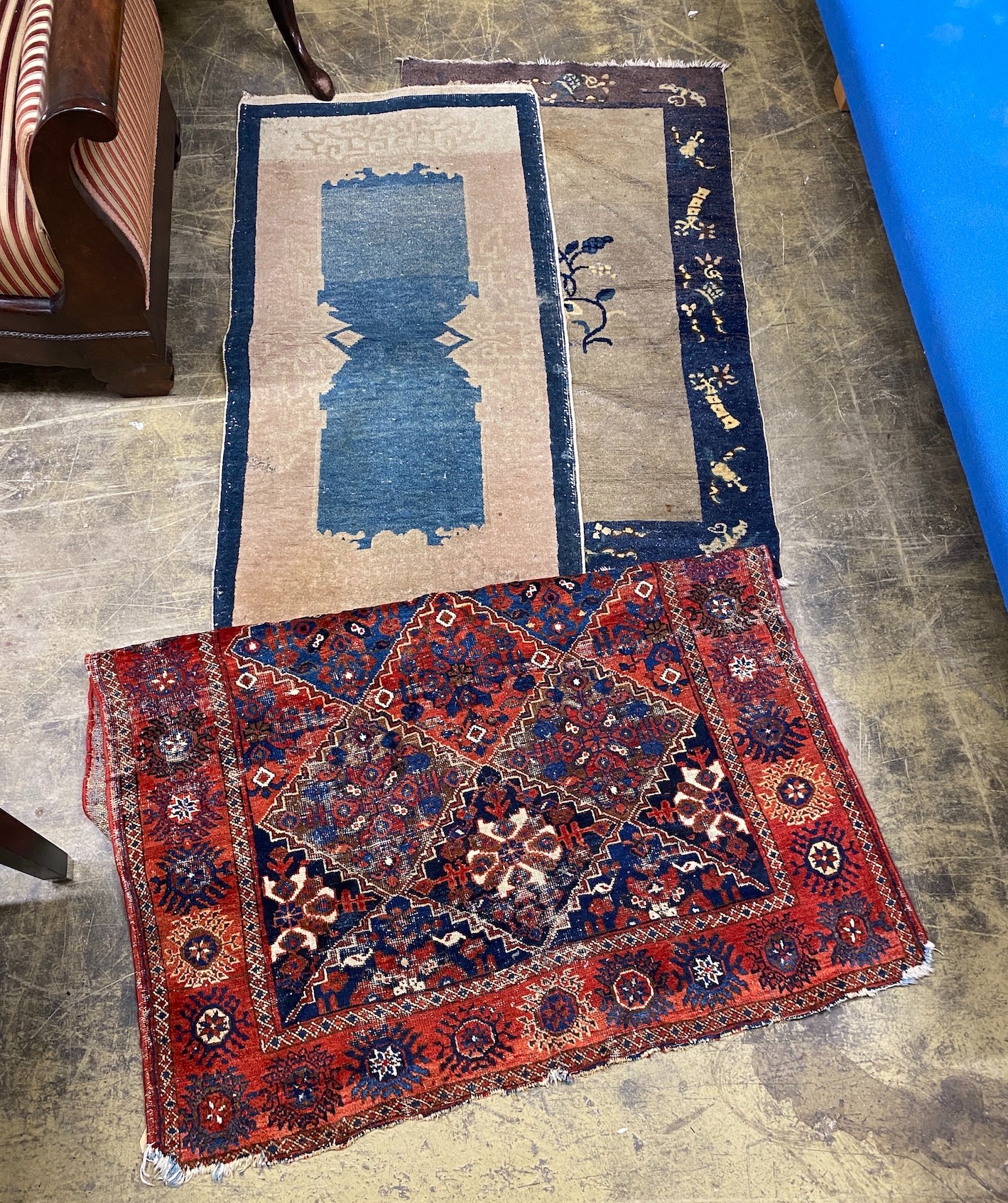 An antique Afshar rug, 140 x 111cm together with three smaller Chinese rugs